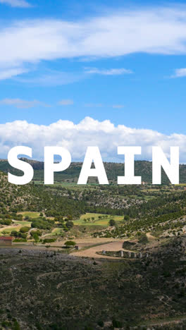 Vertical-Video-Landscape-Of-Countryside-Overlaid-With-Animated-Graphic-Spelling-Out-Spain